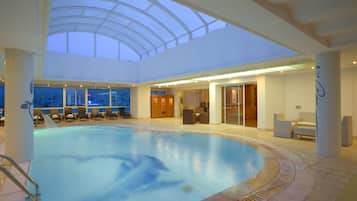 Indoor pool, open 10:00 AM to 6:00 PM, pool loungers