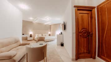 Habitación ejecutiva | Ropa de cama de alta calidad y edredones de plumas