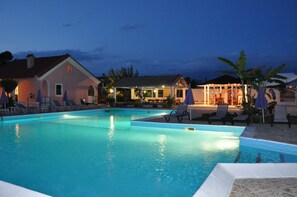 Outdoor pool, open 9:00 AM to 8:00 PM, pool umbrellas, pool loungers