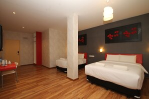 Deluxe Family Room | Individually decorated, desk, blackout drapes, iron/ironing board