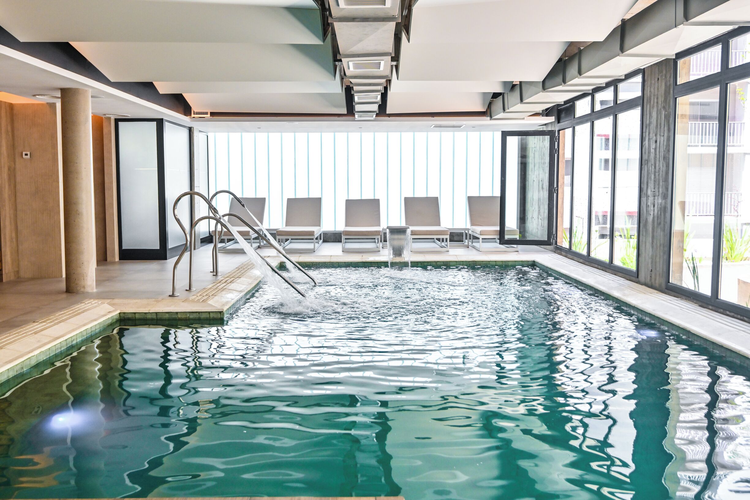 Indoor pool, open 1:00 PM to 9:00 PM, pool loungers