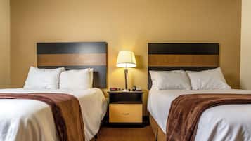 Premium bedding, pillow-top beds, desk, laptop workspace