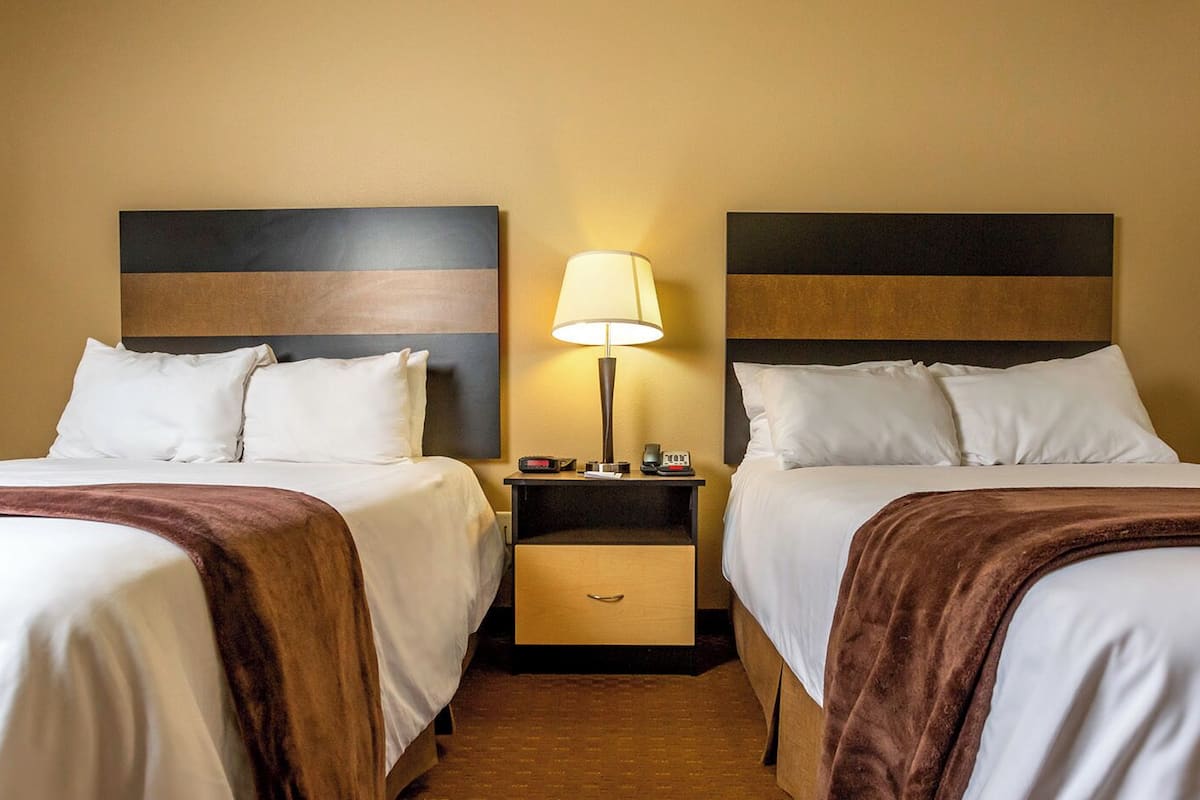premium bedding, pillow-top beds, desk, laptop workspace