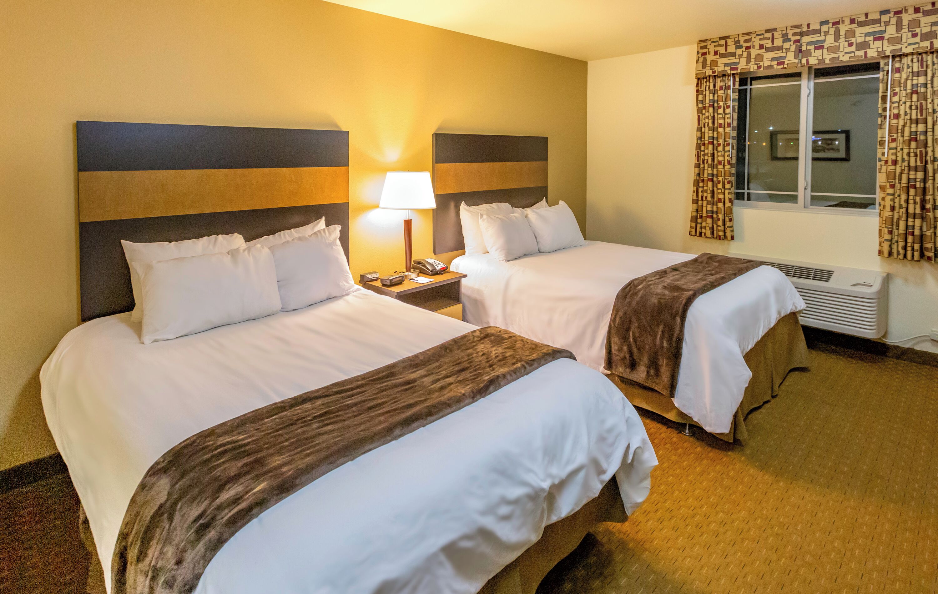 Premium bedding, pillowtop beds, desk, laptop workspace