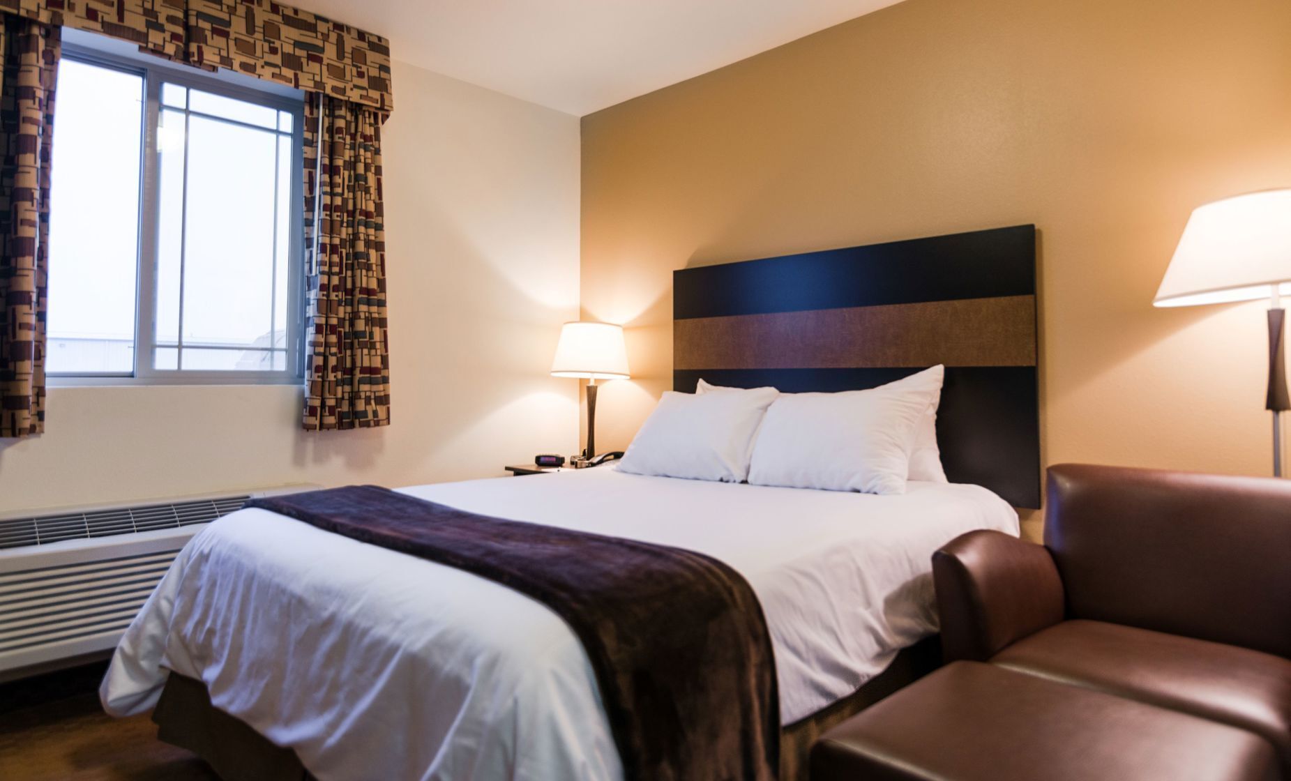 Premium bedding, pillow-top beds, desk, laptop workspace