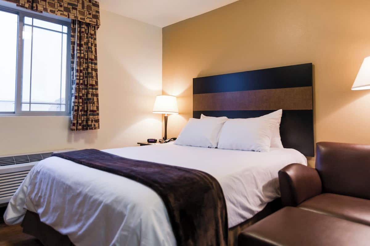 premium bedding, pillow-top beds, desk, laptop workspace