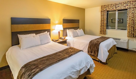 Premium bedding, pillowtop beds, desk, laptop workspace. My Place Hotel - Dickinson, ND