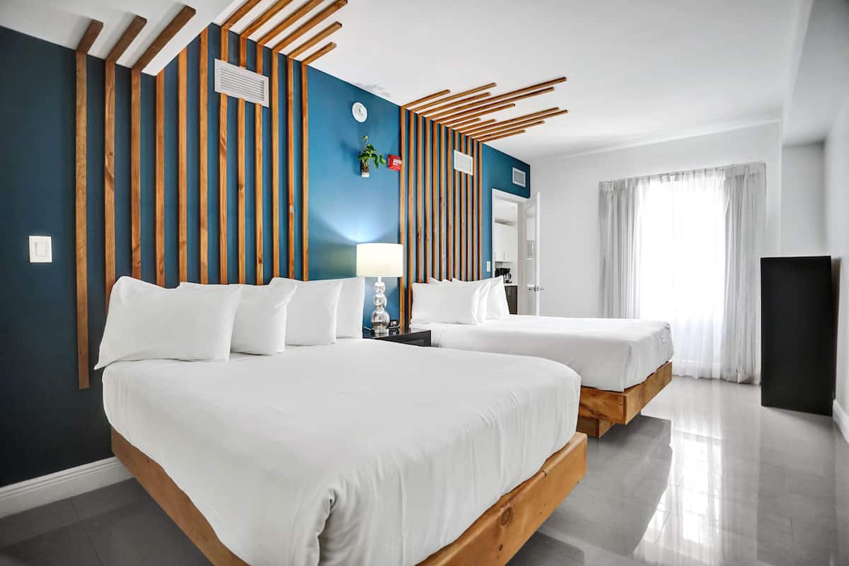 Premium Suite, 2 Bedrooms, Kitchen, Courtyard View | 1 bedroom, down comforters, in-room safe, soundproofing