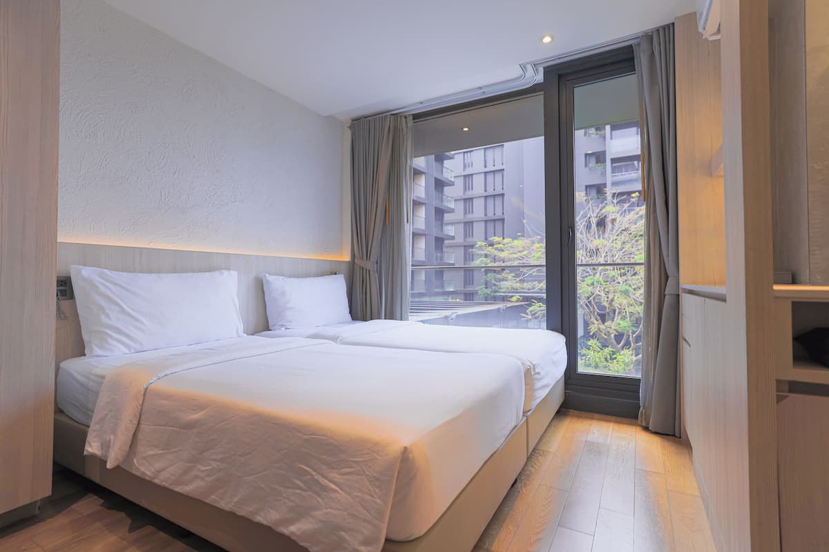 Deluxe Suite 1 Bedroom-Twin Bed | 1 habitación, caja de seguridad en la habitación y escritorio