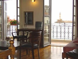 Standard Room, Balcony, City View | Living area | 28-inch flat-screen TV with digital channels, TV