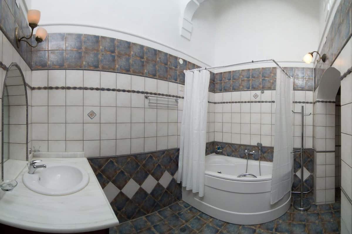 eco-friendly toiletries, hair dryer, slippers, towels