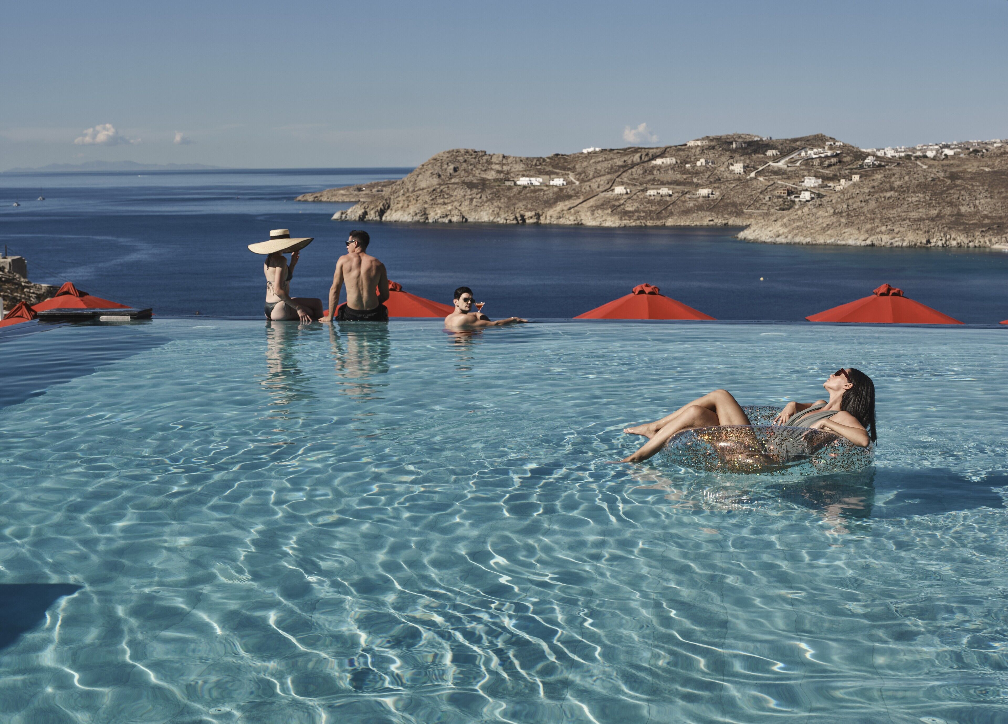 Seasonal outdoor pool, pool umbrellas, pool loungers