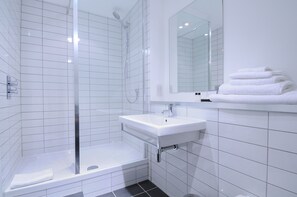Designer toiletries, hair dryer, bathrobes, towels