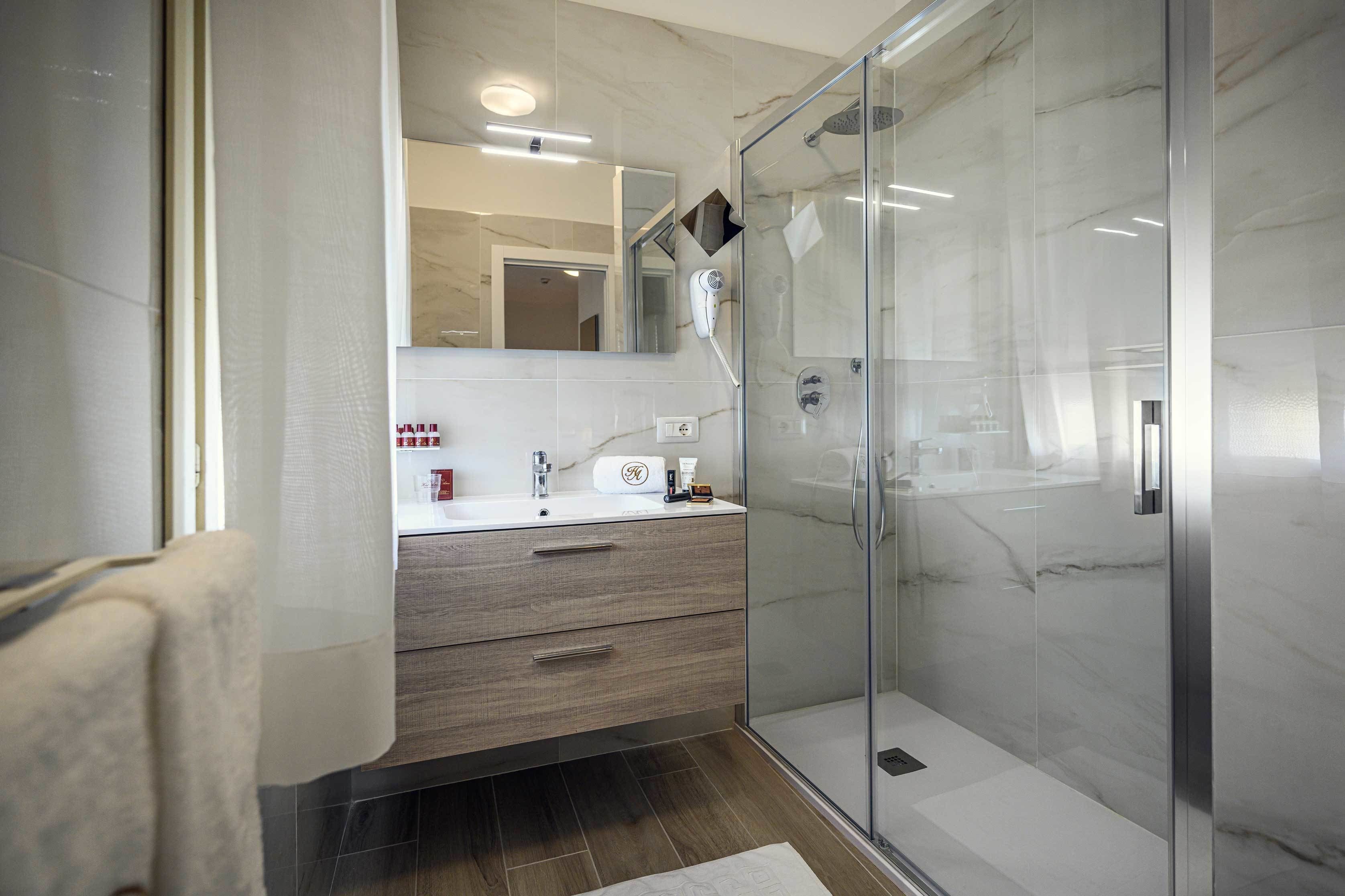 classic quadruple room, multiple beds | bathroom | shower, free toiletries, hair dryer, slippers