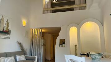 Family Apartment | Living area | 24-inch LCD TV with satellite channels, TV, DVD player