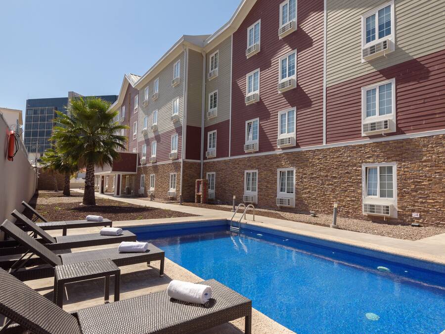 Outdoor pool, open 9:00 AM to 8:00 PM, pool loungers