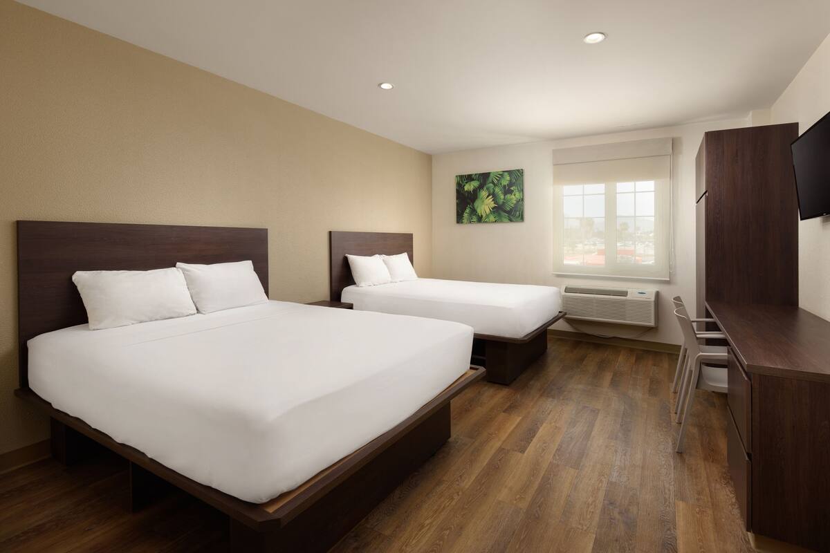 Suite, 2 Queen Beds | Desk, bed sheets