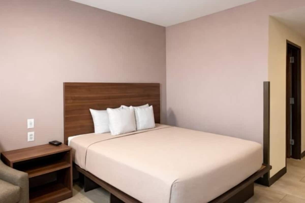Desk, blackout curtains, bed sheets
