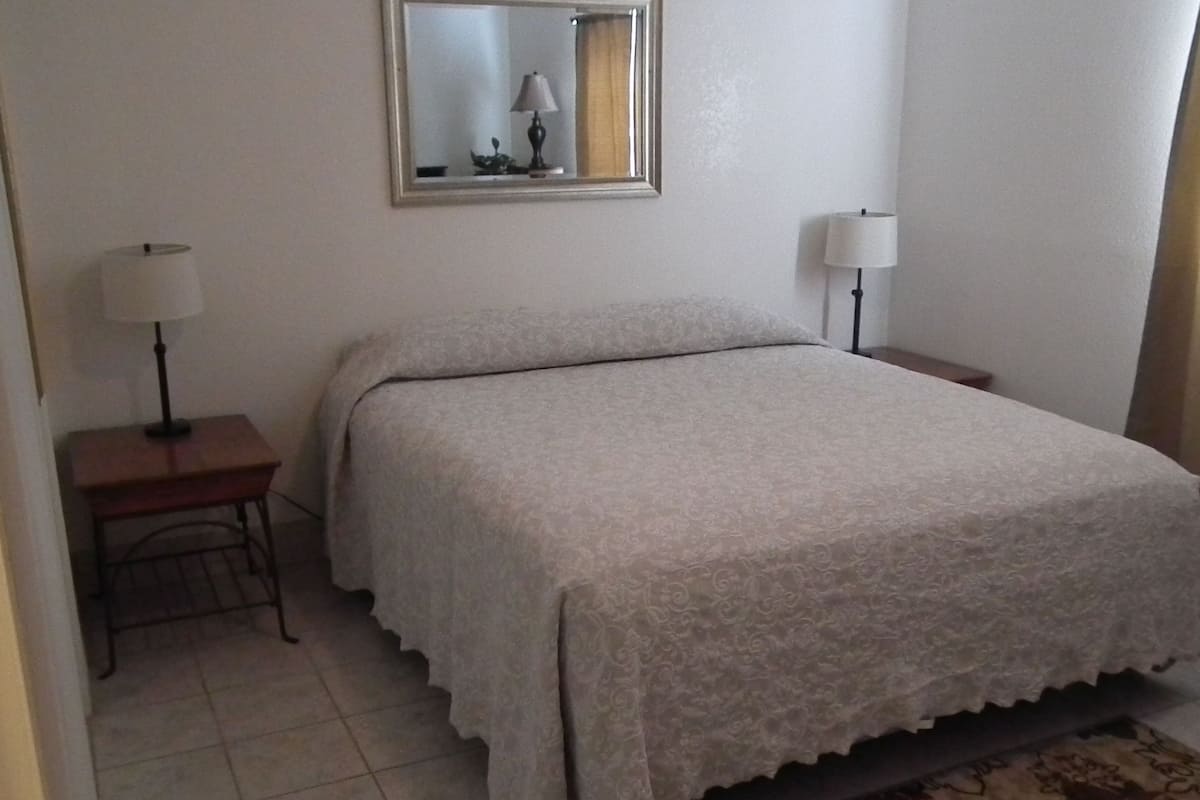 Deluxe Cottage, 1 King Bed, Kitchen | Iron/ironing board, rollaway beds (free), individually furnished