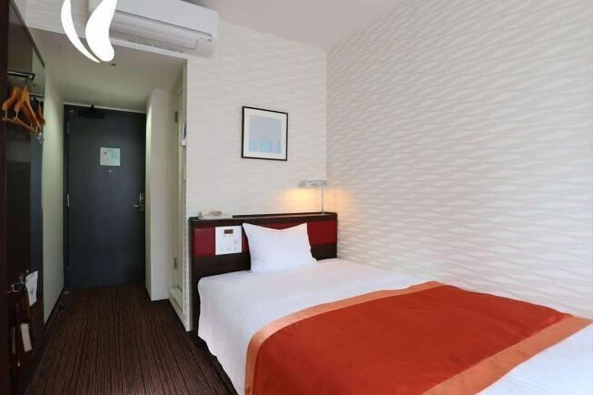 Down comforters, desk, blackout drapes, iron/ironing board