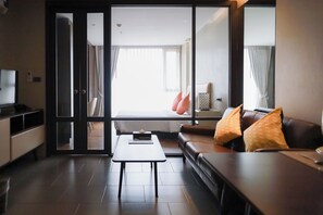 Luxury Room, 1 Bedroom | Living room | 32-inch LCD TV with cable channels, TV - Balcony Courtyard Sriracha Hotel Serviced Apartmen (Si Racha)