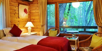 Log Cottage | Down comforters, minibar, desk, iron/ironing board