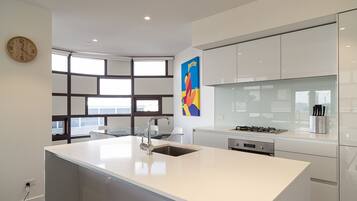 Three Bedroom Penthouse | Private kitchen | Fridge, microwave