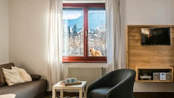 Apartamento, 1 quarto (Oskar) | Sala de estar | TV de tela plana