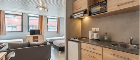 Family Room (4 People) | 1 bedroom, desk, blackout drapes, iron/ironing board