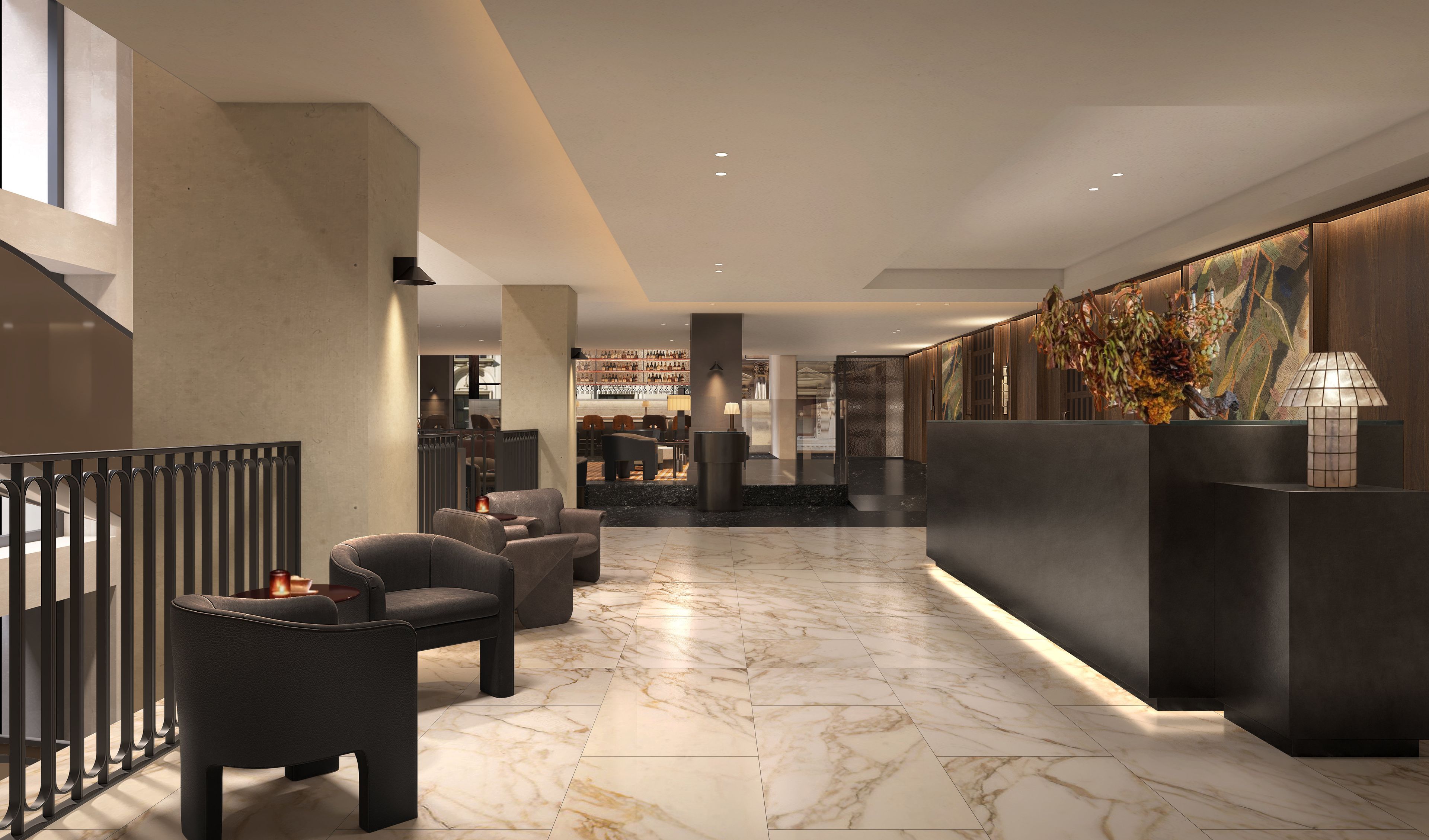 A modern lobby with a reception desk, seating area, and a bar.