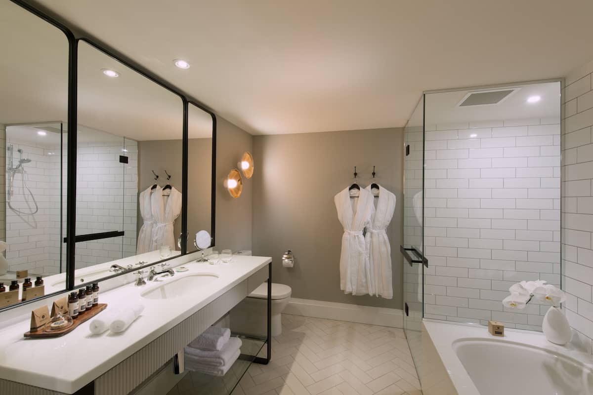 designer toiletries, hair dryer, bathrobes, slippers