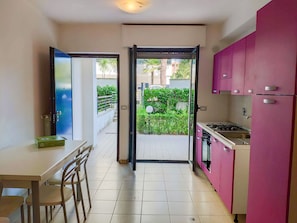 Full-sized fridge, stovetop, cookware/dishes/utensils