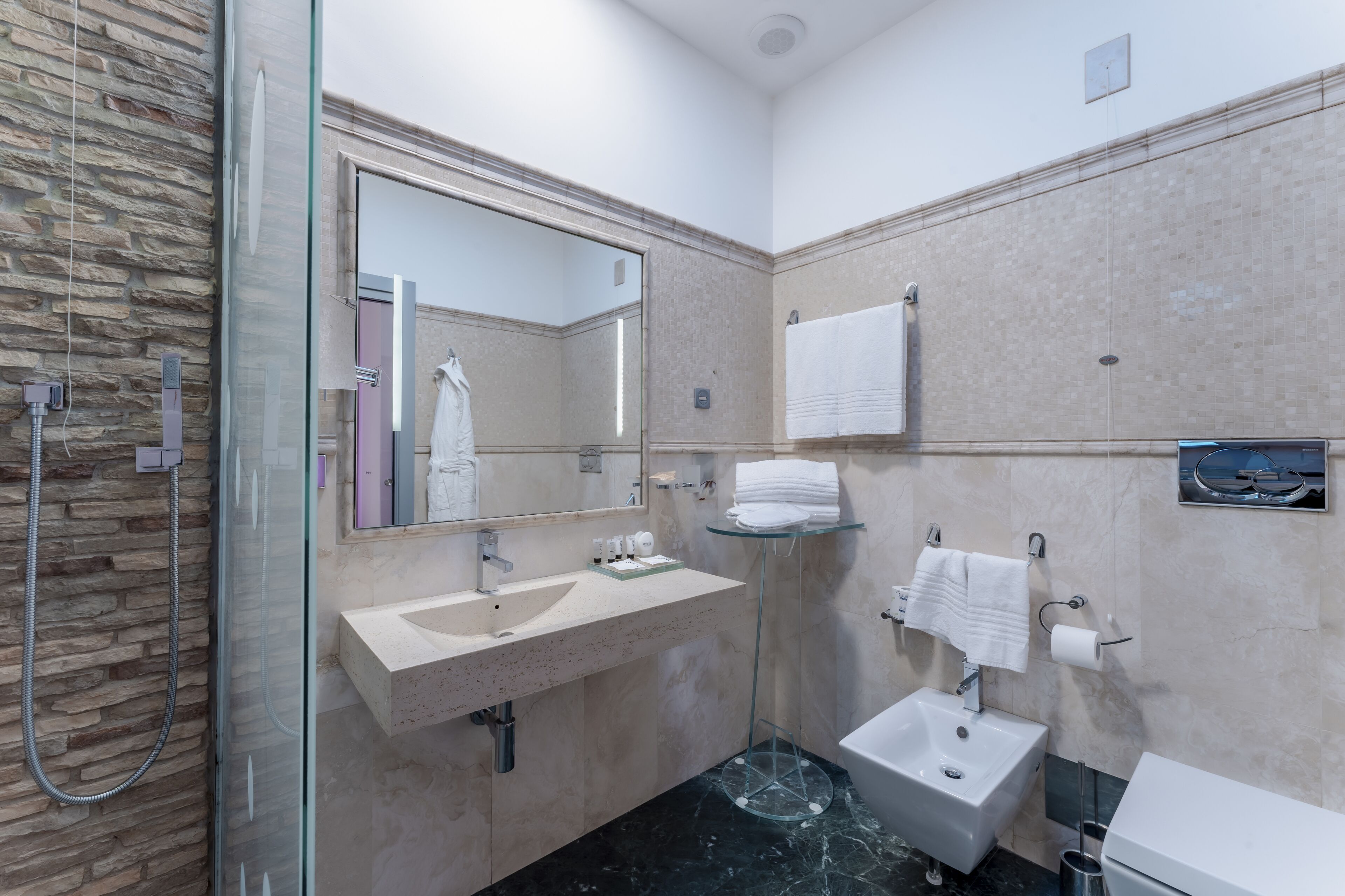 junior suite, 1 king bed, bathtub, city view | bathroom | eco-friendly toiletries, hair dryer, bidet, towels
