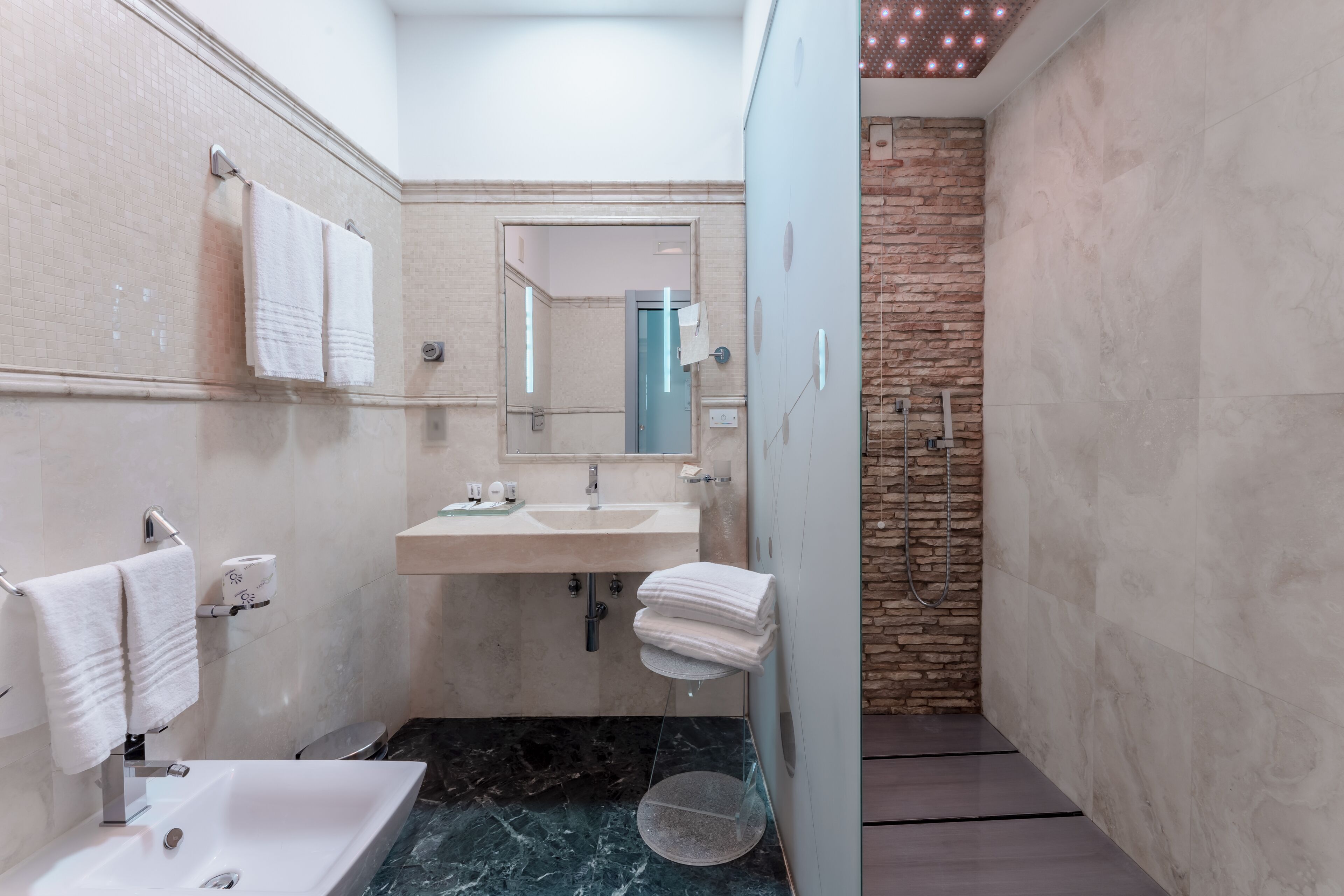 superior double room | bathroom | eco-friendly toiletries, hair dryer, bidet, towels
