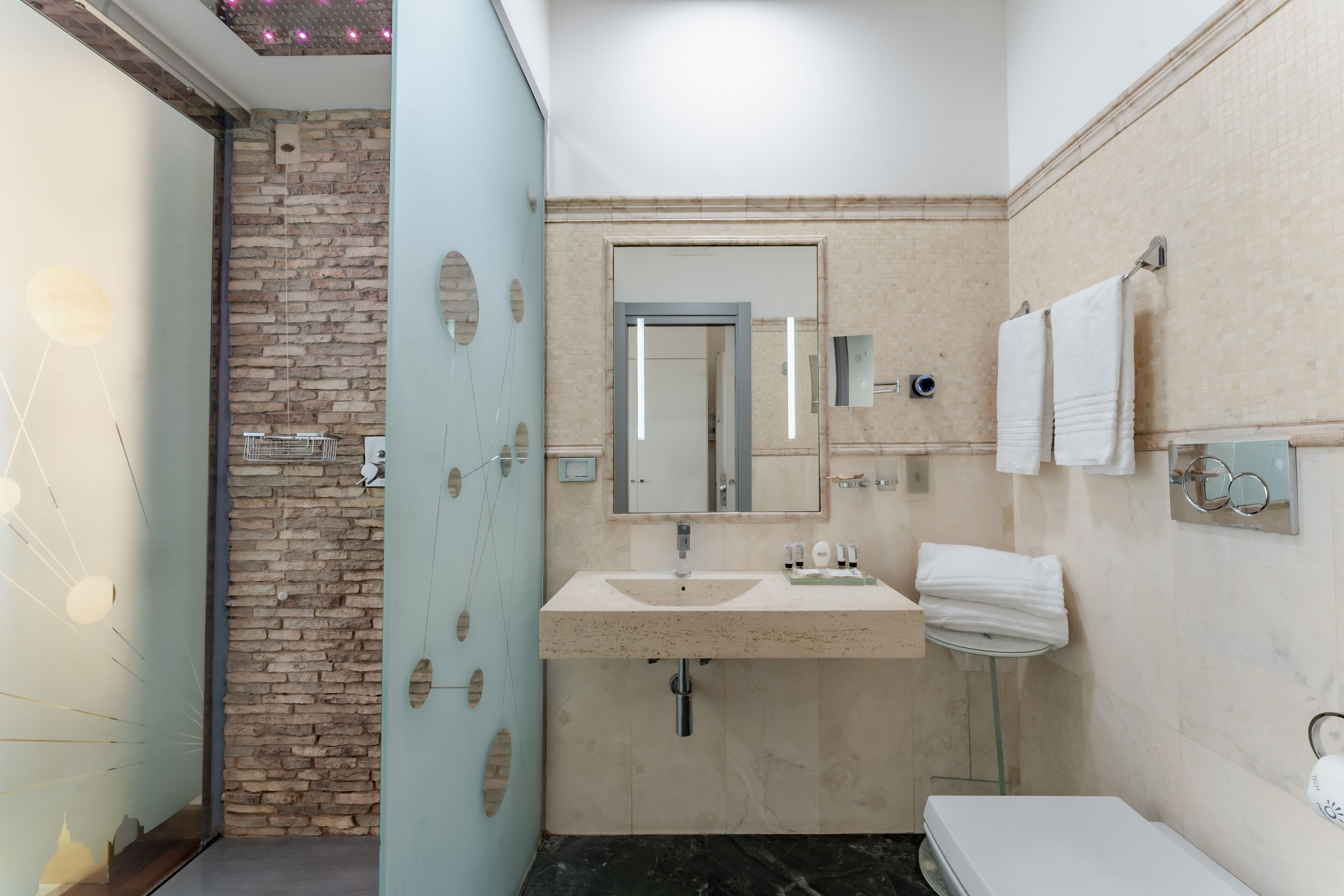 deluxe double room | bathroom | eco-friendly toiletries, hair dryer, bidet, towels