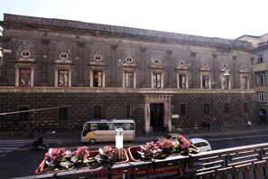 A historic building with a symmetrical facade, large windows, and decorative elements. - Talismano Luxury B&B (Naples)