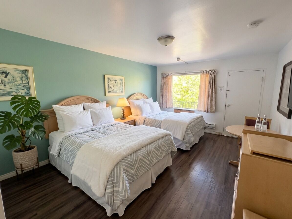 Comfort Room, 2 Queen Beds | In-room safe, desk, free WiFi, bed sheets