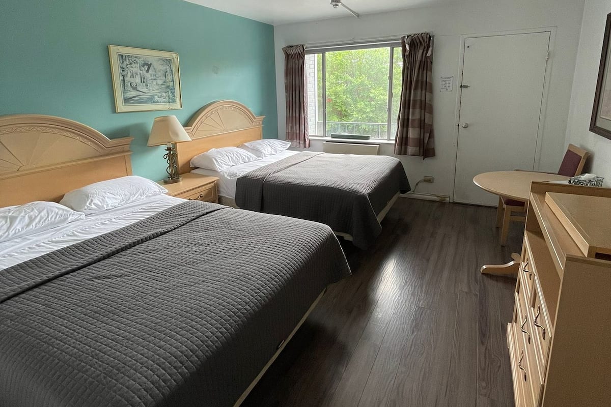 Comfort Room, 2 Queen Beds | In-room safe, desk, free WiFi, bed sheets