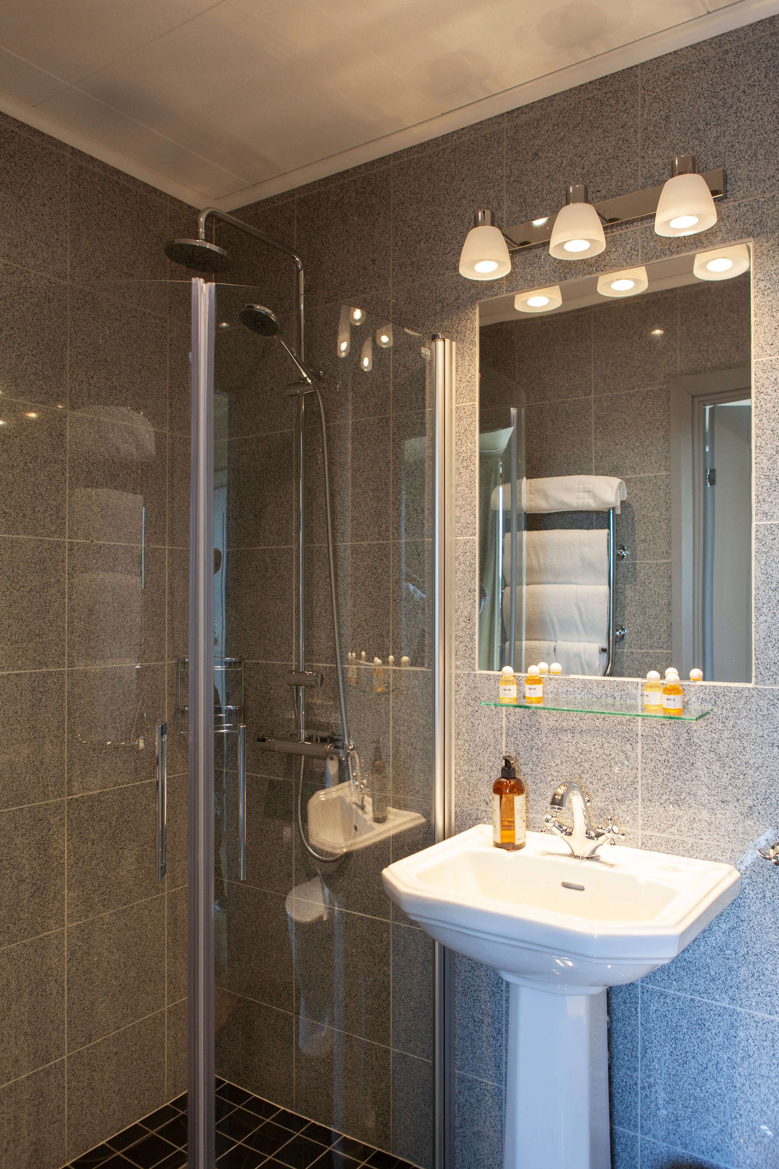 superior single room | bathroom | shower, free toiletries, hair dryer, towels