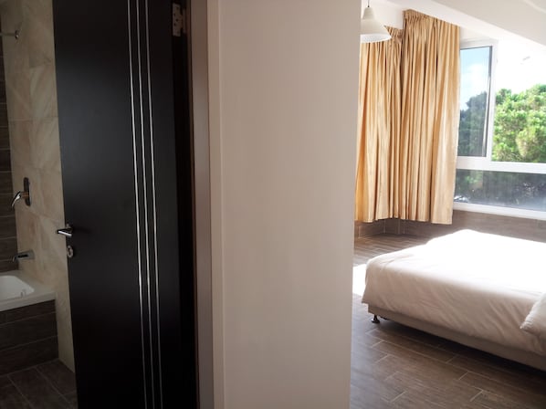 Studio, 1 Bedroom | Living area | 32-inch LED TV with cable channels, TV