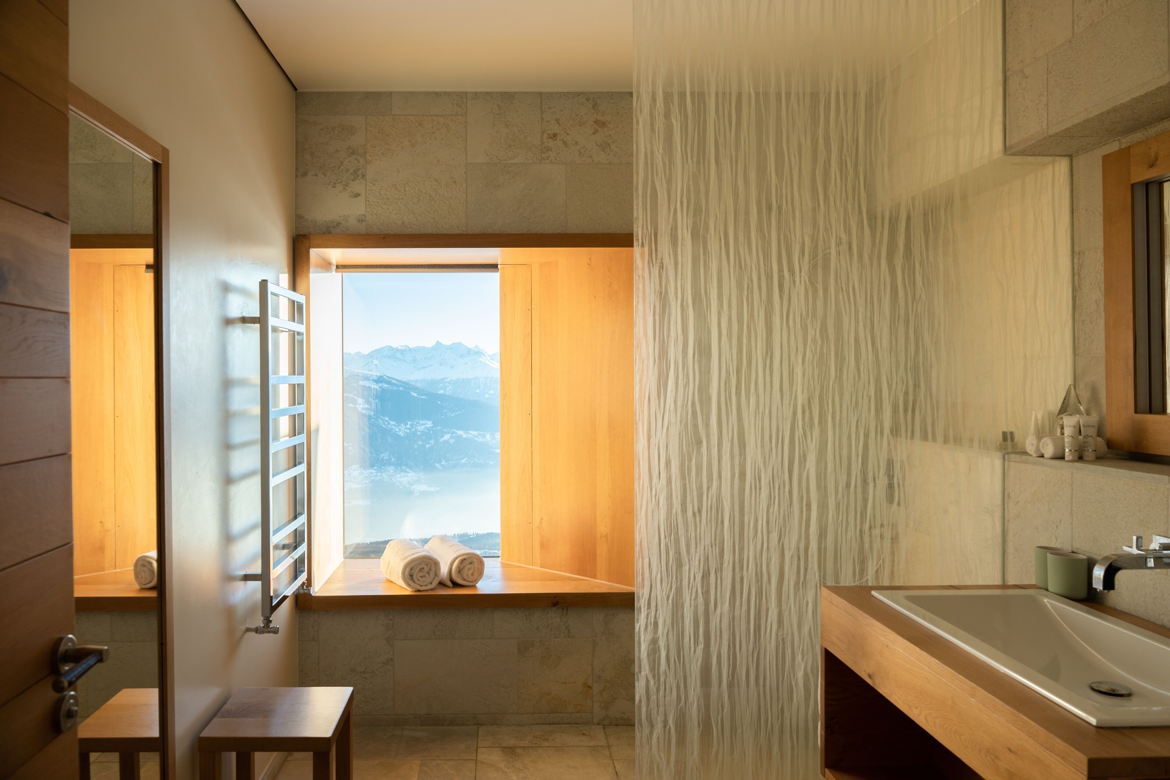 deluxe room, corner | bathroom | hair dryer, bathrobes, slippers, towels