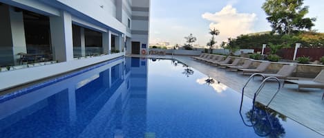 Outdoor pool, open 6:00 AM to 6:00 PM, sun loungers