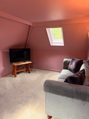 Luxury Room | Living area | Flat-screen TV