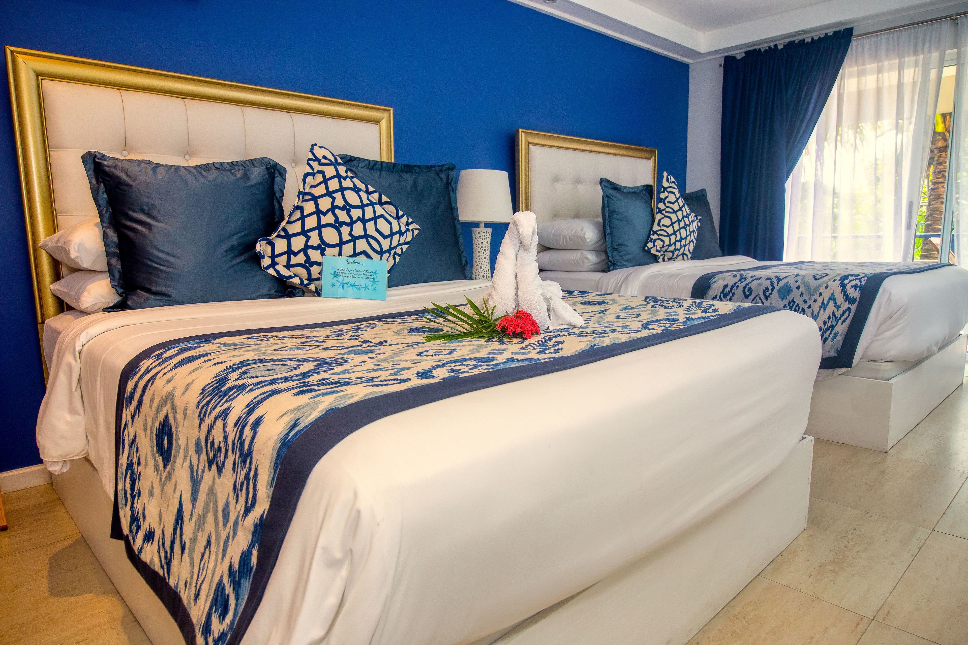 room, 2 queen beds, kitchenette, pool view | pillow-top beds, in-room safe, individually decorated