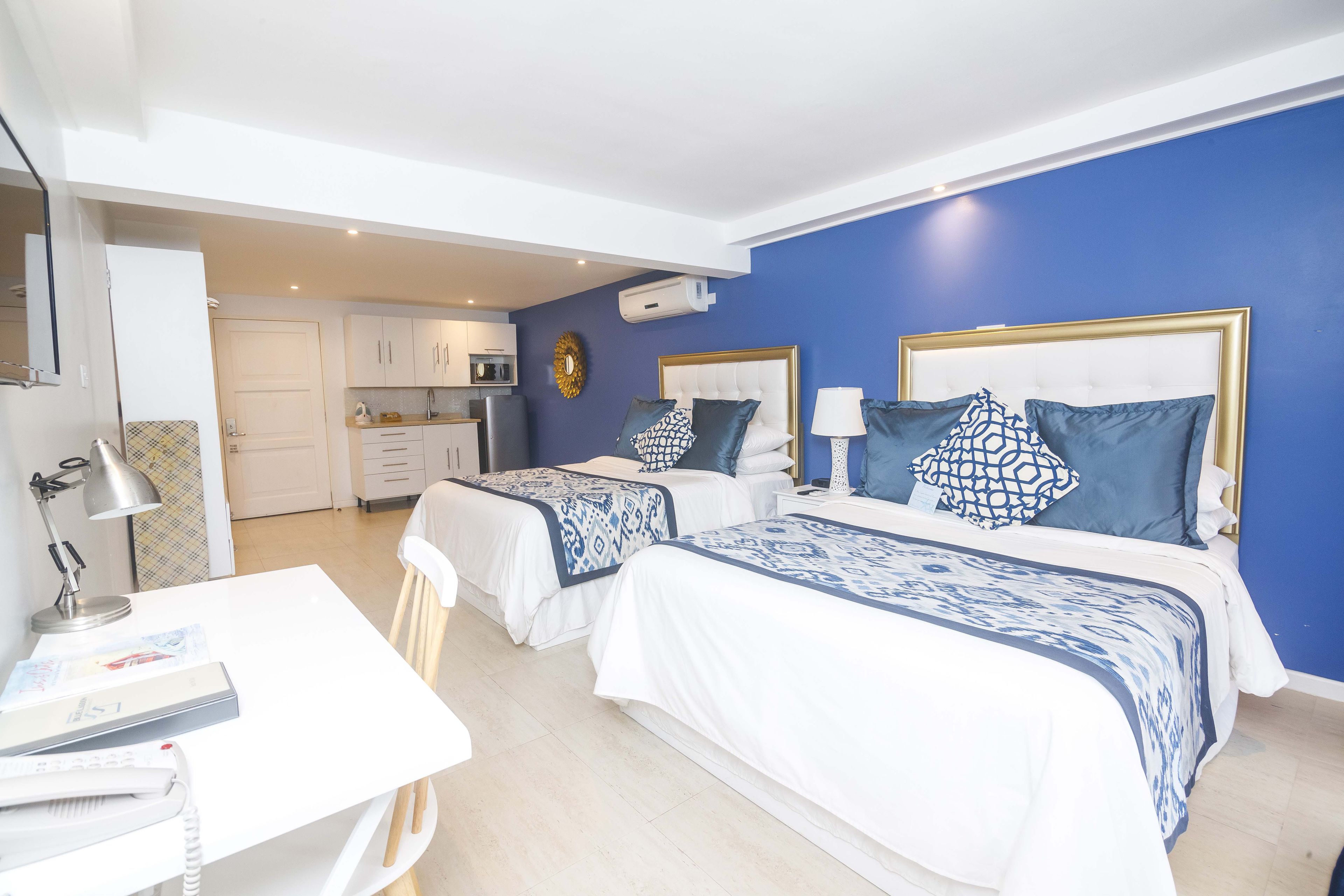 room, 2 queen beds, kitchenette, pool view | pillow-top beds, in-room safe, individually decorated