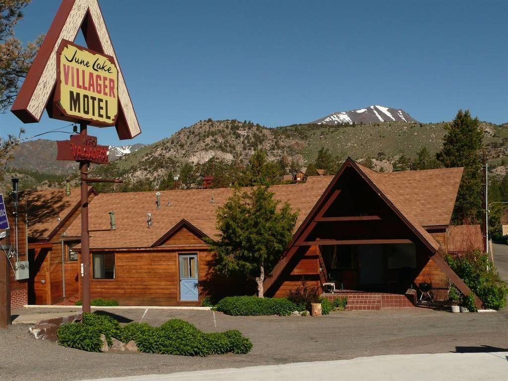 A rustic motel with a prominent sign for the June Lake Villager Motel.