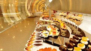A buffet with various desserts and dishes arranged on a long table. - Green Nature Diamond Hotel (Marmaris)