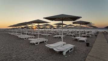 Sun loungers, beach umbrellas, beach towels, beach volleyball
