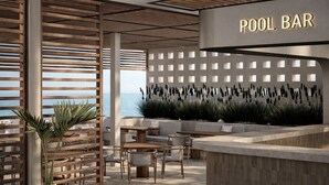 A pool bar with a wooden slatted wall, seating area, and a view of the sea. - Fun Sun Smart Akman Beach - All inclusive (Kemer)