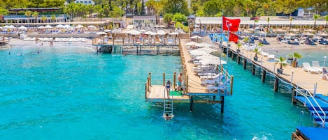 Private beach, free beach shuttle, free beach cabanas, sun-loungers